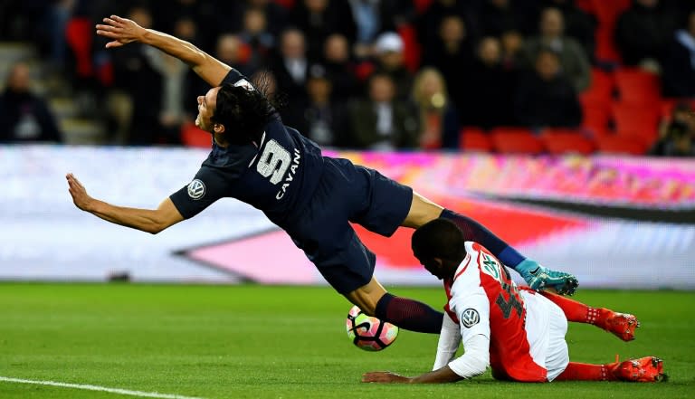 Monaco's defender Safwan Mbae vies with Paris Saint-Germain's forward Edinson Cavani during the French Cup semi-final match April 26, 2017