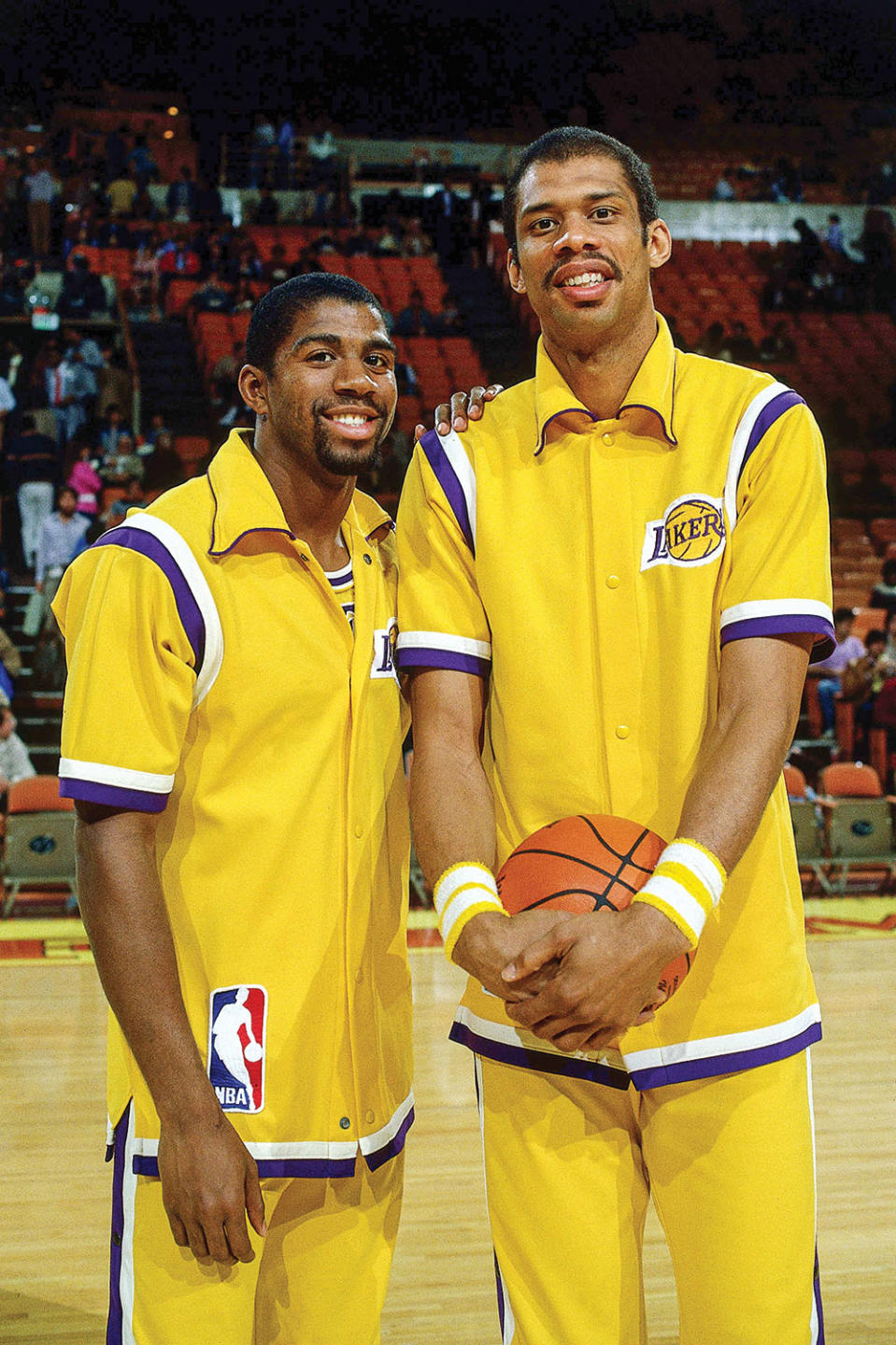 Magic Johnson (left) and Kareem Abdul-Jabbar, circa ’84. - Credit: ANDREW D. BERNSTEIN/ NBAE/ GETTY IMAGES.