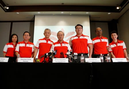 Members of the newly-launched PSP pose for a group photo after a press conference in Singapore