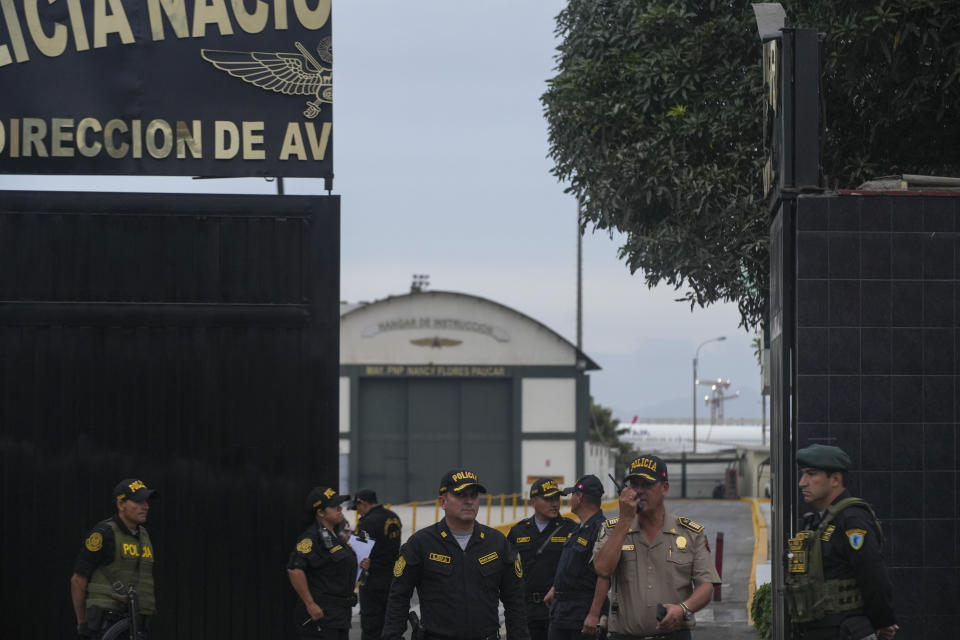 Police guard the entrance to the police terminal next to the international airport from where Peru's former President Alejandro Toledo will be taken to a detention facility after arriving in Lima, Peru, extradited from the United States, Sunday, April 23, 2023. Toledo will face charges for allegedly receiving bribes from the Brazilian construction company Odebrecht in return for awarding public works contract while in office between 2001 and 2006. (AP Photo/Guadalupe Pardo)