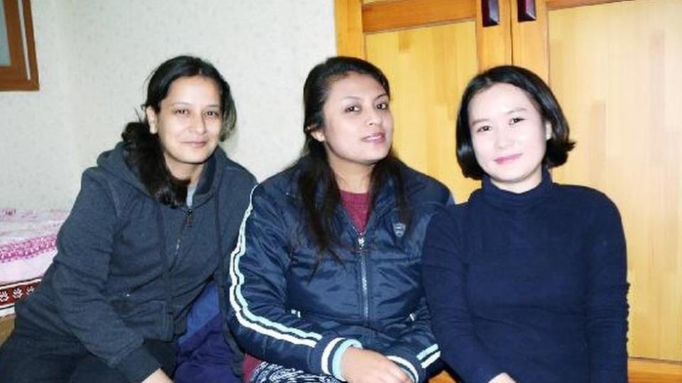 Kim Hana with two other Nepalese students.