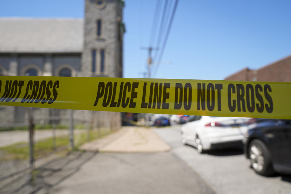 Police tape cordons off the scene of a fatal shooting at Delaware County Linen in Chester, Pa., Wednesday, May 22, 2024. Authorities say a former employee armed with a handgun opened fire at a linen company in a Philadelphia suburb, killing multiple people and wounding three others. (AP Photo/Matt Rourke)