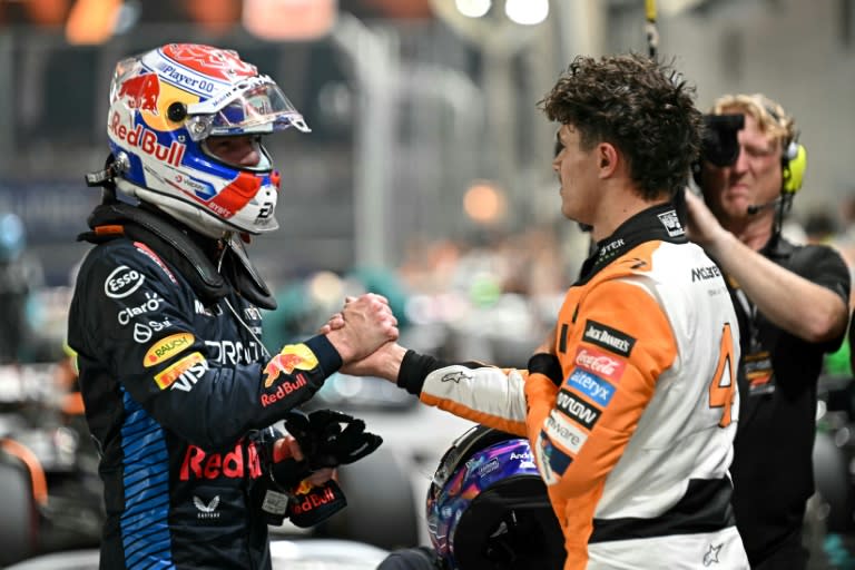 Lando Norris (right) is congratulated by Max Verstappen at the end of qualifying for Sunday's SIngapore Grand Prix (Lillian SUWANRUMPHA)