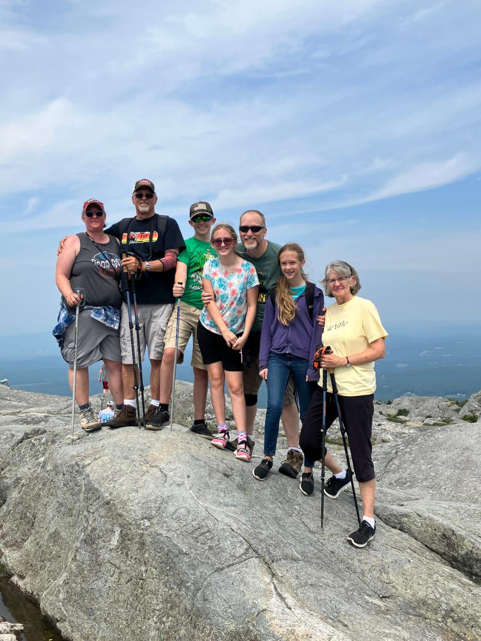 Art Holden (second from left) and his daughter, son-in-law, grandchildren and wife pose for a photo atop Mount Monadnock outside of Jaffrey, New Hampshire. Climbing to the 3,165-foot summit is a family tradition dating back nearly 100 years.