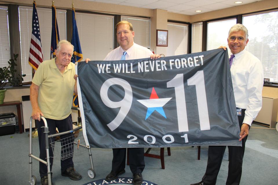 Clarkstown Supervisor George Hoehmann and Councilman Frank Borelli attend a flag ceremony.