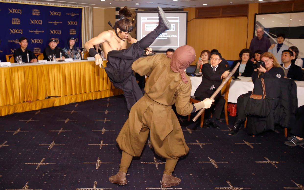 Members of Iga ninja group Ashura demonstrate a ninja-inspired martial-art  - AP