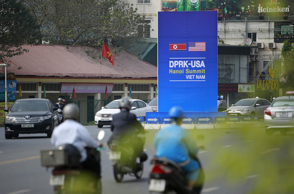 In this Feb. 21, 2019, photo, traffic passes a poster featuring the upcoming Trump-Kim summit in Hanoi, Vietnam. The Vietnamese capital once trembled as waves of American bombers unleashed their payloads, but when Kim Jong Un arrives here for his summit with President Donald Trump he won’t find rancor toward a former enemy. Instead, the North Korean leader will get a glimpse at the potential rewards of reconciliation. (AP Photo/Hau Dinh)