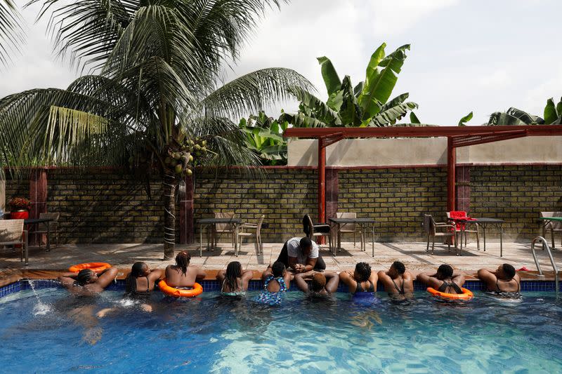 The Wider Image: Nigeria's female bouncers show their strength fighting stereotypes