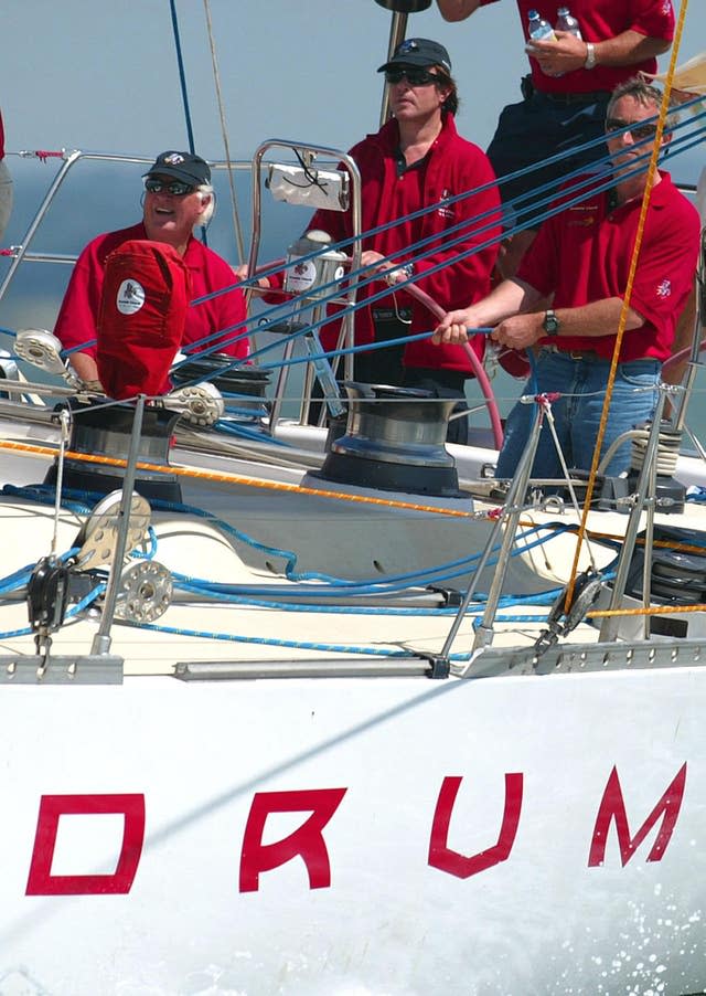 Duran Duran lead singer Simon Le Bon at the helm of his yacht Drum during the start of the Fastnet race from Cowes 