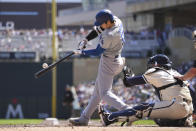 Los Angeles Dodgers designated hitter Shohei Ohtani hits a single during the fifth inning of a baseball game against the Minnesota Twins, Wednesday, April 10, 2024, in Minneapolis. (AP Photo/Abbie Parr)