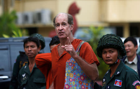 FILE PHOTO: Australia filmmaker James Ricketson (C) speaks to the media at the Supreme Court in Phnom Penh, Cambodia, January 17, 2018. REUTERS/Samrang Pring/File Photo