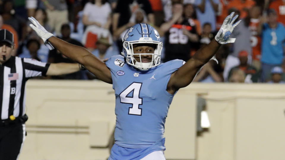 FILE - In this Sept. 7, 2019, file photo, North Carolina's Trey Morrison (4) celebrates after he broke up a long pass during the third quarter of an NCAA college football game against Miami in Chapel Hill, N.C., Saturday, Sept. 7, 2019. Morrison entered preseason camp set to play nickelback, only to start working at free safety with the goal of being ready to play anywhere in the secondary on short notice. That is because the 18th-ranked Tar Heels, like many teams, are preparing for roster uncertainty sure to come amid the coronavirus pandemic. Positive tests, contact tracing and quarantines could abruptly alter any roster along with the injury risk that has long been part of the game. (AP Photo/Chris Seward, File)