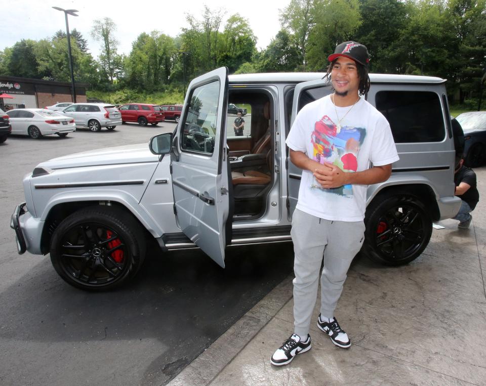 Ohio State quarterback CJ Stroud was all smiles after taking delivery of his Mercedes at Sarchione Auto Gallery in Jackson Township on Wednesday, June 8, 2022.