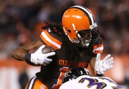 Cleveland Browns wide receiver Travis Benjamin (11) breaks a tackle from Baltimore Ravens strong safety Will Hill (33) in the first half at FirstEnergy Stadium. The Ravens won 33-27. Mandatory Credit: Aaron Doster-USA TODAY Sports