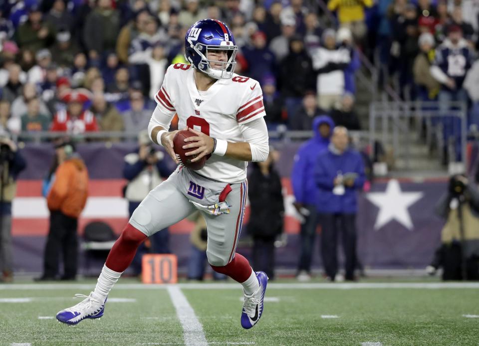 New York Giants quarterback Daniel Jones rolls out to pass against the New England Patriots in the first half of an NFL football game, Thursday, Oct. 10, 2019, in Foxborough, Mass. (AP Photo/Elise Amendola)