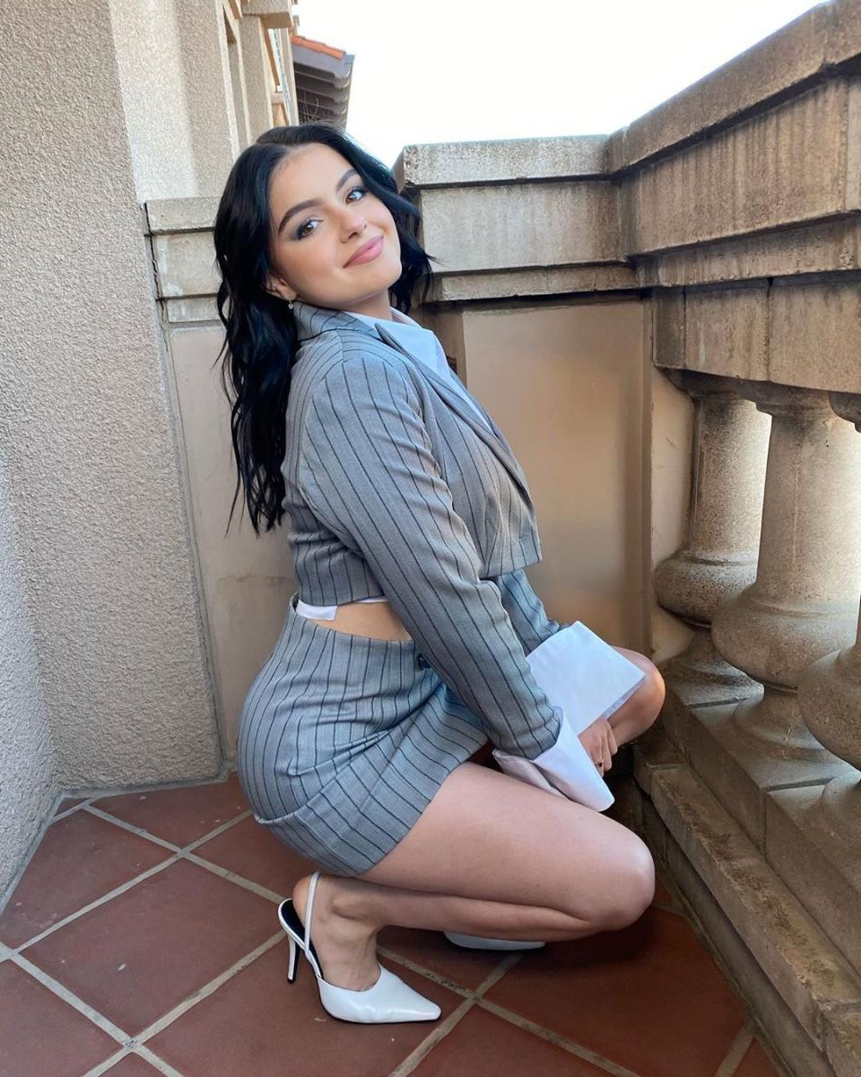 Ariel Winter poses on a balcony