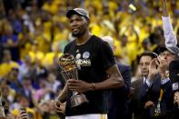 <p>Kevin Durant #35 of the Golden State Warriors celebrates after being named Bill Russell NBA Finals Most Valuable Player after defeating the Cleveland Cavaliers 129-120 in Game 5 to win the 2017 NBA Finals at ORACLE Arena on June 12, 2017 in Oakland, California. </p>