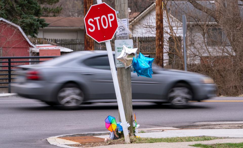 Cars whiz by, Friday, March 18, 2022, on the day two vehicles struck Sevion Sanford, age 6. The street has minimal places to walk for pedestrians. 