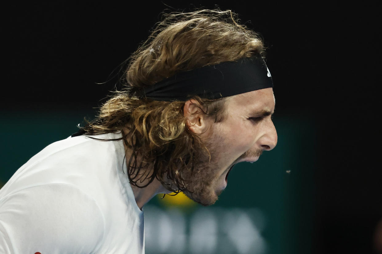 Stefanos Tsitsipas of Greece yells out after losing a point to Novak Djokovic of Serbia during the men's singles final at the Australian Open tennis championships in Melbourne, Australia, Sunday, Jan. 29, 2023. (AP Photo/Asanka Brendon Ratnayake)