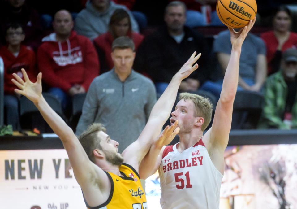Bradley's Rienk Mast (51) shoots over Valpo's Ben Krikke in the first half Saturday, Jan. 7, 2023 at Carver Arena. The Braves defeated the Beacons 88-66.