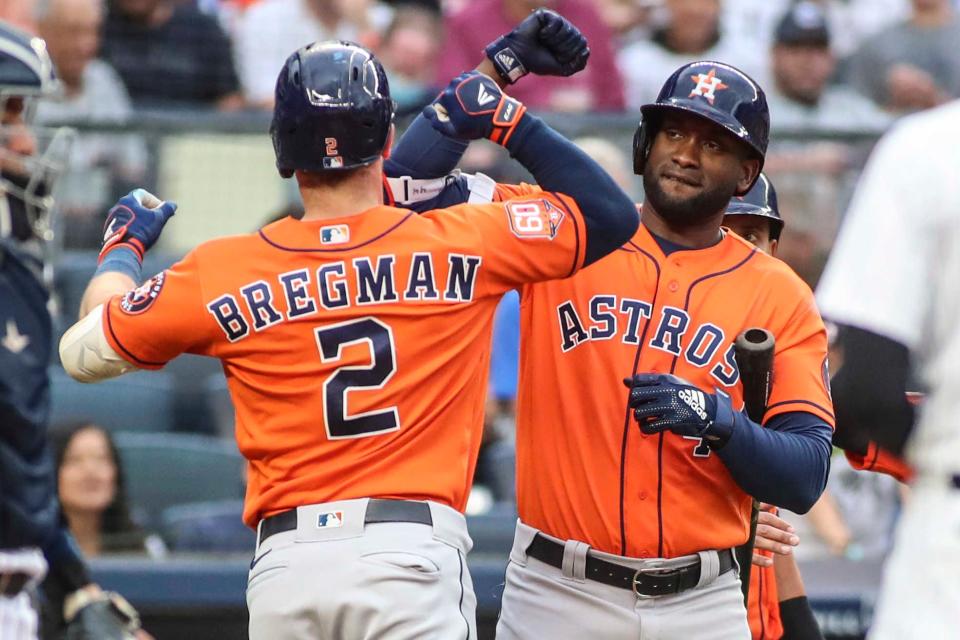 Alex Bregman and Yordan Alvarez celebrate a home run against the Yankees.