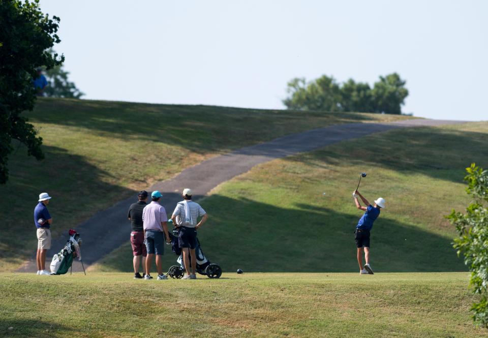 Participants tee off on the 11th hole during the Evansville Men's City Golf Tournament qualifying round at Helfrich Hills Golf Course in Evansville, Ind., Saturday morning, July 2, 2022.