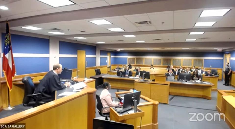 In this frame grab from video, Sidney Powell, a former attorney for former President Donald Trump, attends a hearing with her attorney Brian Rafferty before Judge Scott McAfee on Thursday at the Fulton County Courthouse in Atlanta. Powell pleaded guilty in the Georgia election interference case and was sentenced to six years probation, a fine, and she will be required to testify in future trials.