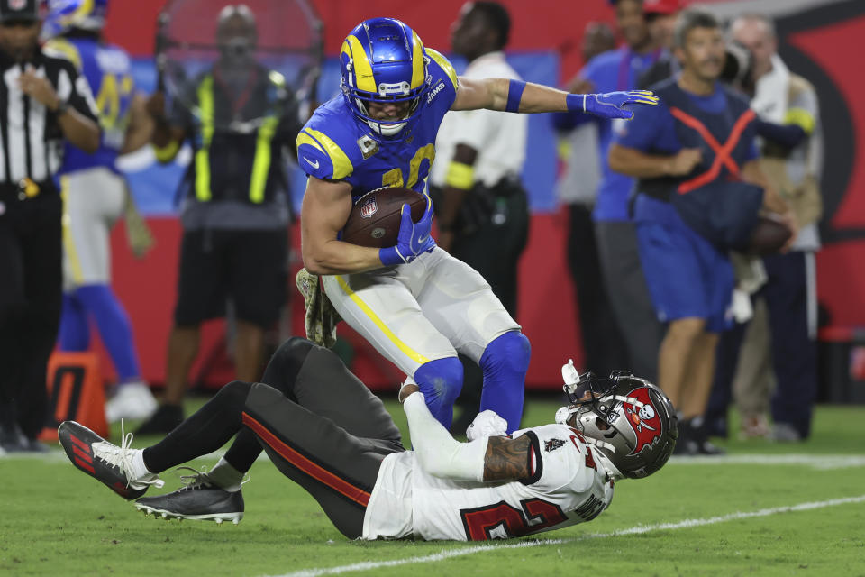 Los Angeles Rams safety Taylor Rapp (24) tackles Los Angeles Rams wide receiver Cooper Kupp (10) during the second half of an NFL football game between the Los Angeles Rams and Tampa Bay Buccaneers, Sunday, Nov. 6, 2022, in Tampa, Fla. (AP Photo/Mark LoMoglio)