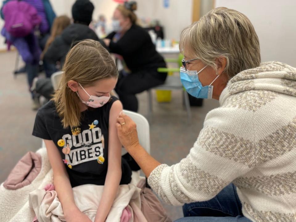 Hedda Kehler, 10, receives a shot of the vaccine against COVID-19 on Nov. 26.  (Sara Minogue/CBC - image credit)