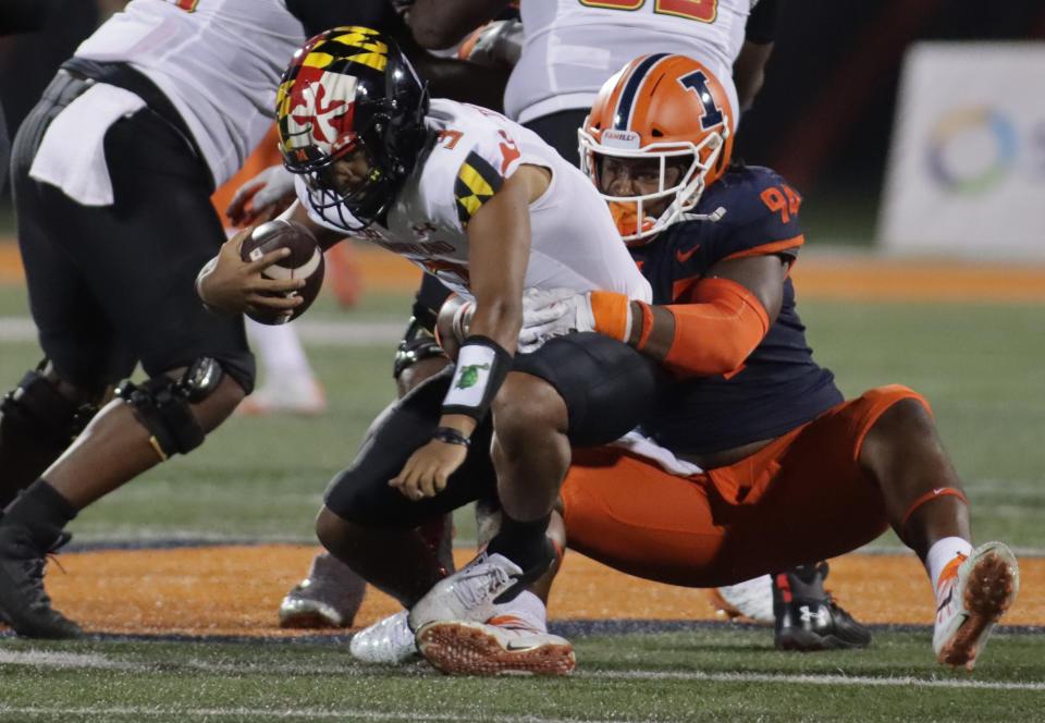 Sep 17, 2021; Champaign, Illinois, USA; Illinois Fighting Illini defensive lineman Jer’Zhan Newton (94) sacks Maryland Terrapins quarterback Taulia Tagovailoa (3) in the first half at Memorial Stadium. Mandatory Credit: Ron Johnson-USA TODAY Sports