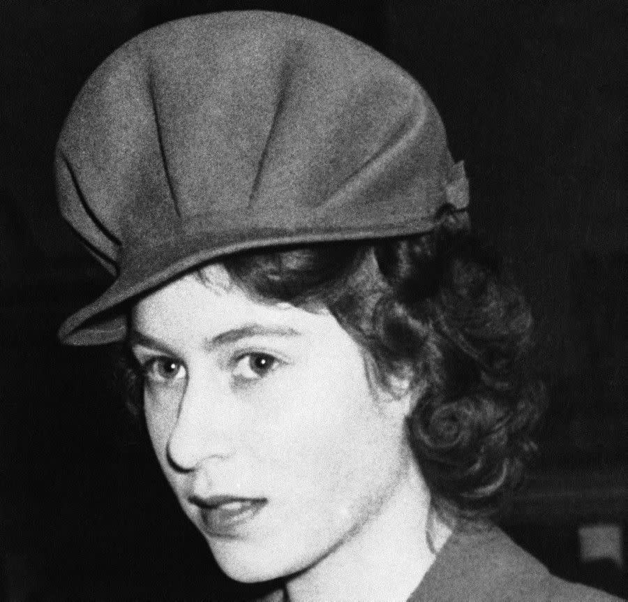 Elizabeth paved the way for trendy headwear long before Kate Middleton ever donned a fascinator. Here, the 18-year-old royal is seen sporting a stylish, military-inspired hat while visiting an exhibition in London on Jan. 31, 1944.