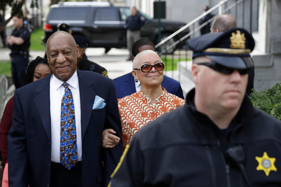 FILE - In this April 24, 2018, file photo, Bill Cosby, left, arrives with his wife, Camille, for his sexual assault trial, at the Montgomery County Courthouse in Norristown, Pa. Cosby's trial judge has rejected a defense motion to step down from the sex assault case before the sentencing hearing scheduled for Monday, Sept. 24. (AP Photo/Matt Slocum, File)