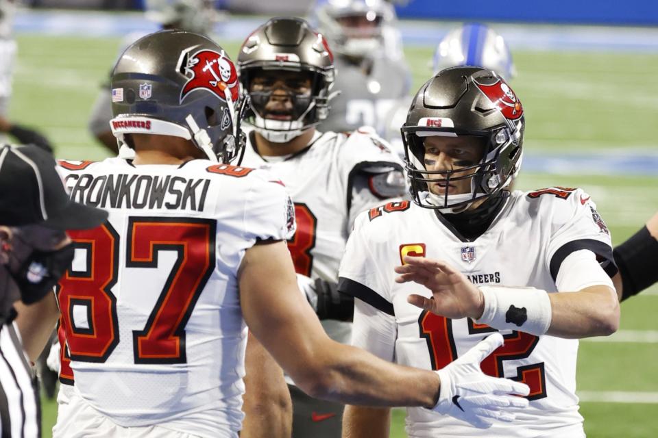 Tampa Bay Buccaneers tight end Rob Gronkowski (87) receives congratulations from quarterback Tom Brady.