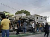 People surround the truck that plowed into a crowd of pilgrims on July 29, 2015 in Mazapil, Zacatecas State, Mexico