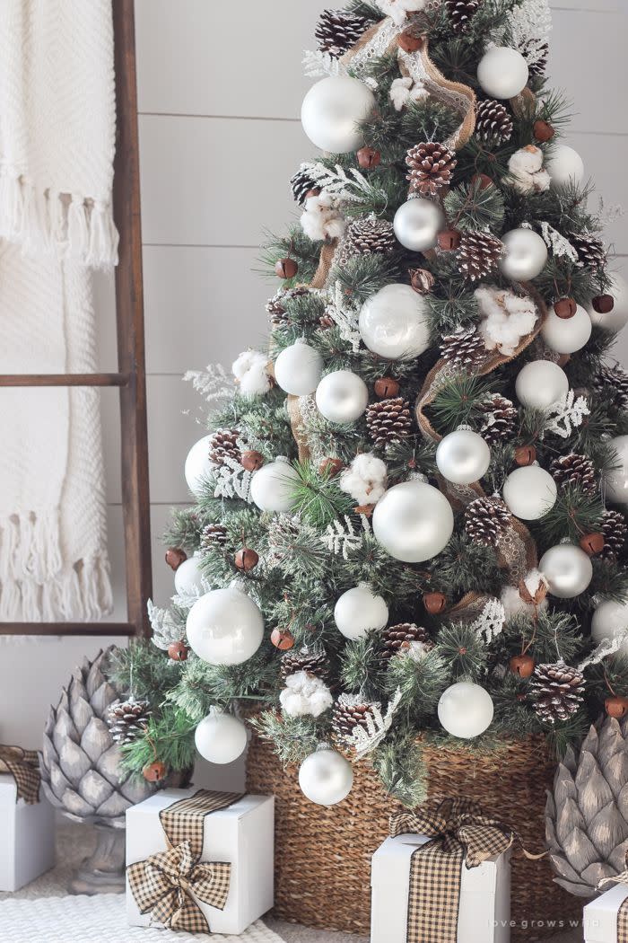 <p>If your home is decorated with fresh whites and natural textures, you'll love this simple tree featuring elements from the great outdoors, such as pine cones and pieces of cotton. </p><p><strong>Get the tutorial at <a href="http://lovegrowswild.com/2016/11/simple-farmhouse-christmas-bedroom/#more-8389" rel="nofollow noopener" target="_blank" data-ylk="slk:Love Grows Wild;elm:context_link;itc:0;sec:content-canvas" class="link ">Love Grows Wild</a>. </strong></p><p><a class="link " href="https://www.amazon.com/JOHOUSE-3-5-5Inch-Christmas-Ornaments-Decorations/dp/B095LJ7K8H/ref=sr_1_2?dchild=1&keywords=pine+cones&qid=1631893436&s=home-garden&sr=1-2&tag=syn-yahoo-20&ascsubtag=%5Bartid%7C10050.g.1251%5Bsrc%7Cyahoo-us" rel="nofollow noopener" target="_blank" data-ylk="slk:SHOP PINECONES;elm:context_link;itc:0;sec:content-canvas">SHOP PINECONES</a><br></p>