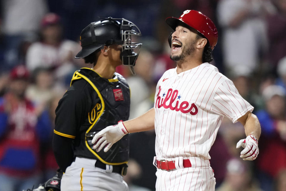 Philadelphia Phillies' Garrett Stubbs, right, react after hitting a three-run home run against Pittsburgh Pirates pitcher Johan Oviedo during the fourth inning of a baseball game, Wednesday, Sept. 27, 2023, in Philadelphia. (AP Photo/Matt Slocum)