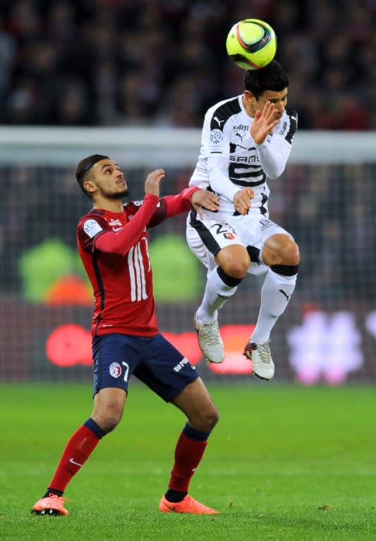 Lille's midfielder Sofiane Boufal (L) fights for the ball with Rennes' midfielder Benjamin Andre during a French L1 football match on February 7, 2016 at the Pierre-Mauroy stadium in Lille, northern France