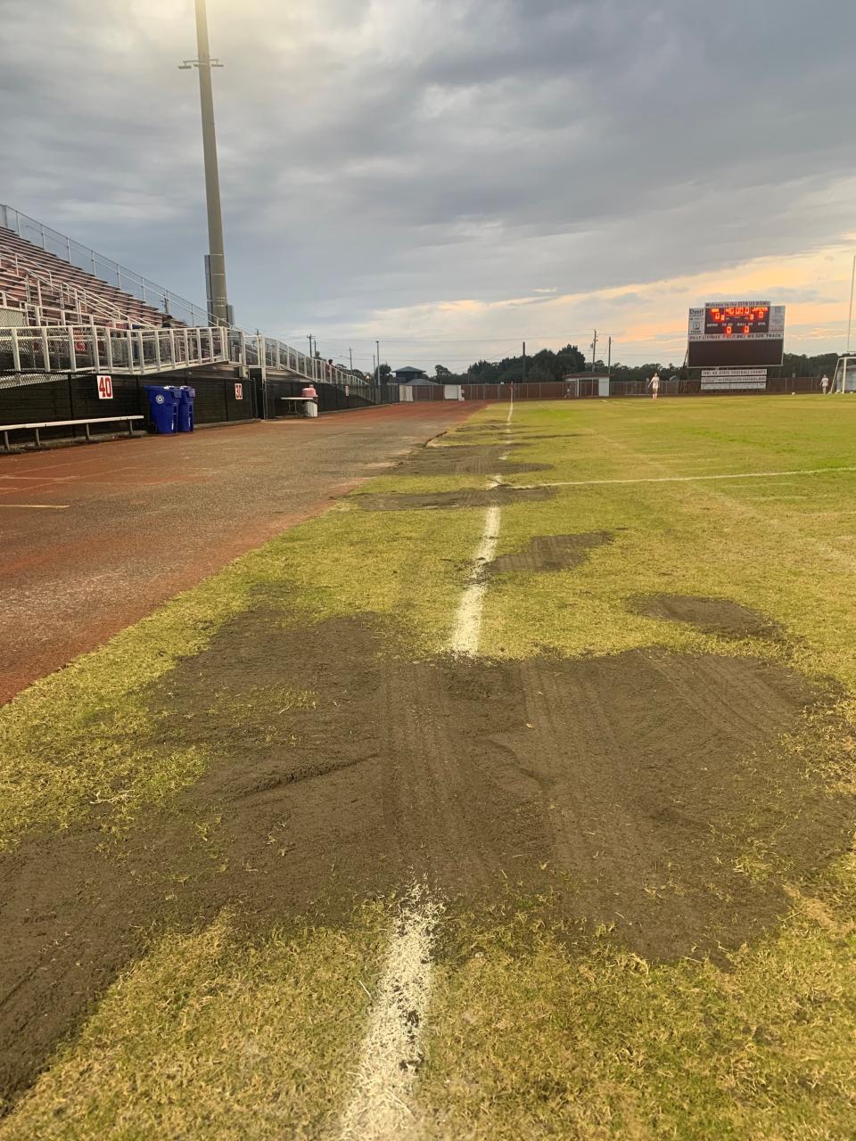 Holes and slopes on the field of the Vero Beach High School Citrus Bowl are shown covered Jan. 21, 2022, before a girls soccer match. The work was done after TCPalm columnist Laurence Reisman asked school officials about dangerous problems found at the field during a girls game Jan. 13, 2022.