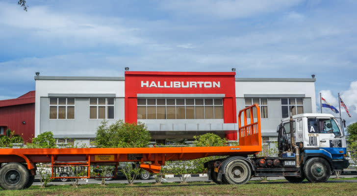 photo of Halliburton (HAL) logo in red on building with truck in front