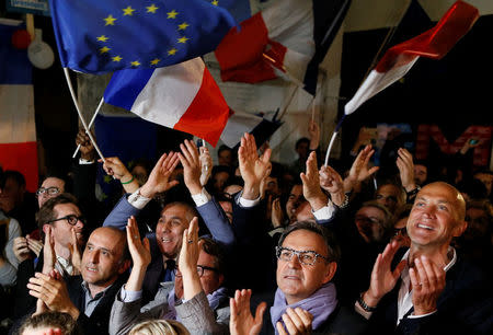 Supporters of Emmanuel Macron celebrate after the second round of 2017 French presidential election, in Lyon, France, May 7, 2017. REUTERS/Robert Pratta