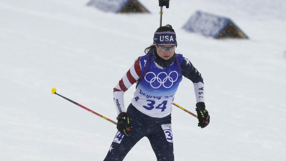 FILE - United States' Joanne Reid skis during the women's 10-kilometer pursuit race at the 2022 Winter Olympics, Sunday, Feb. 13, 2022, in Zhangjiakou, China. The United States Biathlon national champion was sexually harassed and abused for years by a ski-wax technician while racing on the sport's elite World Cup circuit, investigators found. When the two-time Olympian complained, Reid said she was told his behavior was just part of the male European culture. (AP Photo/Kirsty Wigglesworth, File)
