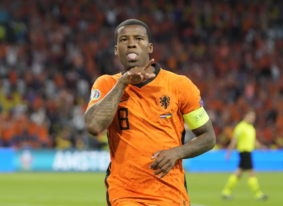 Georginio Wijnaldum of the Netherlands celebrates after scoring his side's opening goal during the Euro 2020 soccer championship group C match between the Netherlands and Ukraine at the Johan Cruijff Arena in Amsterdam, Netherlands, Sunday, June 13, 2021. (AP Photo/Peter Dejong, Pool)