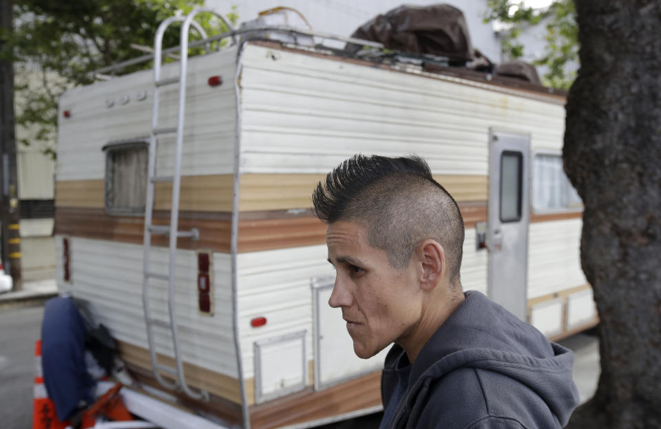 This Thursday, June 27, 2019, photo shows Shanna Couper Orona interviewed outside of her RV parked along a street in San Francisco. A federally mandated count of homeless in San Francisco increased 17% in two years, driven in part by a surge of people living in RVs and other vehicles. (AP Photo/Jeff Chiu)