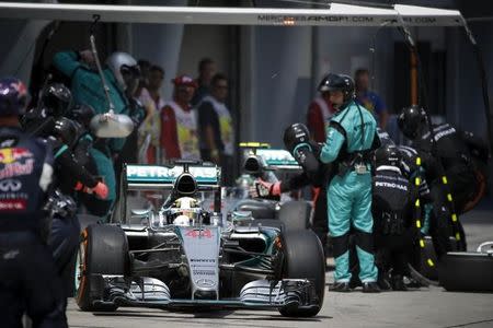 Formula One - F1 - Malaysian Grand Prix 2015 - Sepang International Circuit, Kuala Lumpur, Malaysia - 29/3/15 Mercedes' Lewis Hamilton in the pit during the race Reuters / POOL Livepic