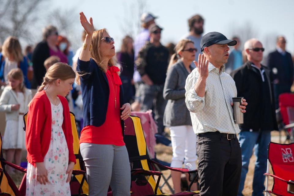 Members of Valley Church sing along to music before an Easter service on April 4, 2021 at the Jamie Hurd Amphitheater in West Des Moines. 