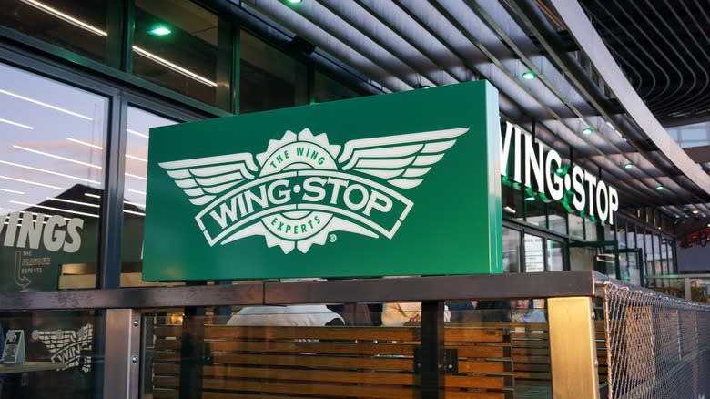 green wingstop sign in front of entrance