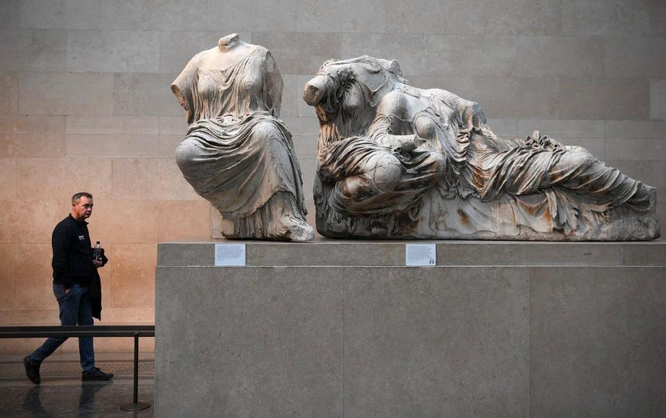 Visitors view the Parthenon Marbles, also known as the Elgin Marbles, at the British Museum, London