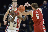 Penn State's Jamari Wheeler (5) and Wisconsin's Tyler Wahl (5) reach for the ball during the second half of an NCAA college basketball game, Saturday, Jan. 30, 2021, in State College, Pa. (AP Photo/Gary M. Baranec)