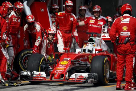 Formula One - Chinese F1 Grand Prix - Shanghai, China - 17/4/16 - Ferrari driver Sebastian Vettel of Germany pulls out after a pit stop during the Chinese Grand Prix. REUTERS/Pool