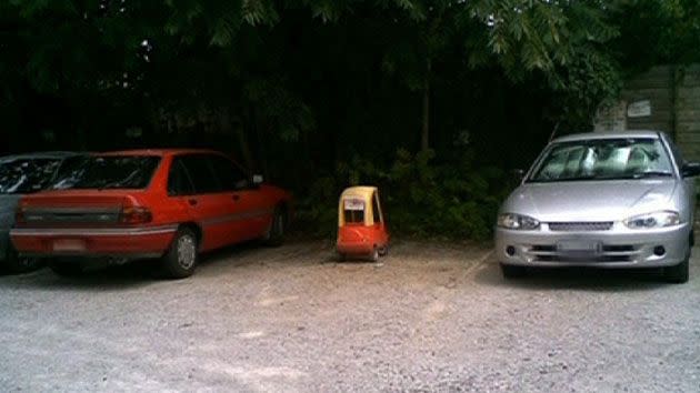 Toy car makes for bizarre viewing parked next to two normal-sized vehicles. Source: Sunrise/supplied